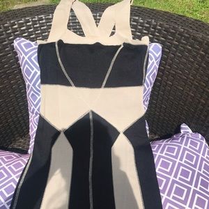 Woman’s black and beige form fitting dress